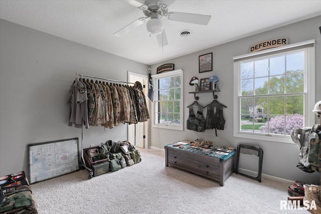 rec room featuring plenty of natural light, carpet flooring, baseboards, and a ceiling fan