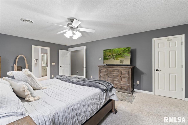 bedroom featuring visible vents, carpet floors, baseboards, ceiling fan, and connected bathroom