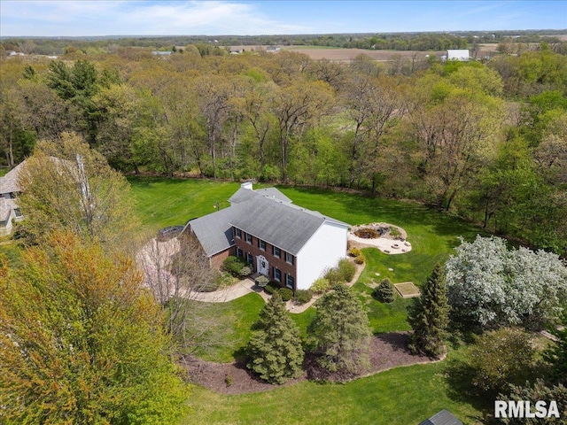 aerial view featuring a wooded view