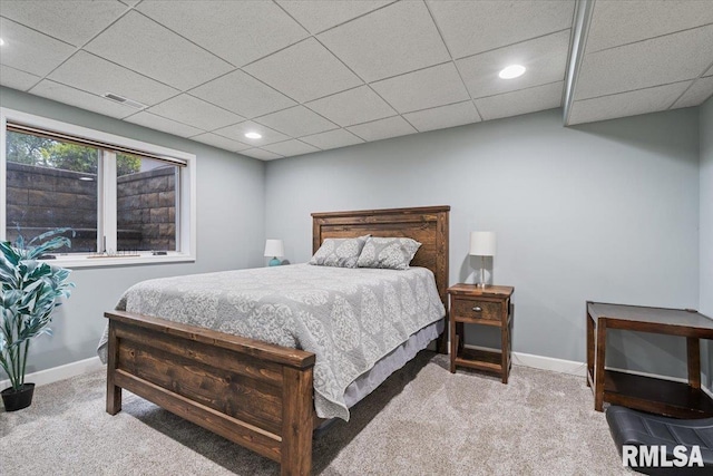 carpeted bedroom featuring recessed lighting, baseboards, visible vents, and a paneled ceiling