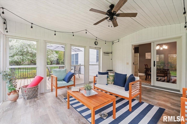 sunroom / solarium featuring plenty of natural light, ceiling fan, and outdoor lounge area