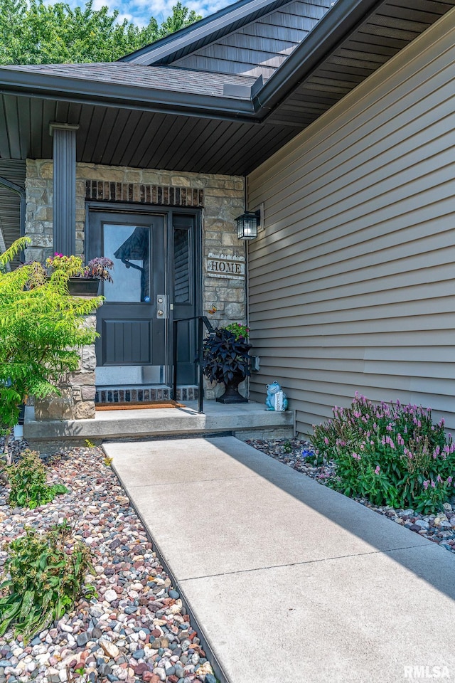 view of exterior entry with stone siding