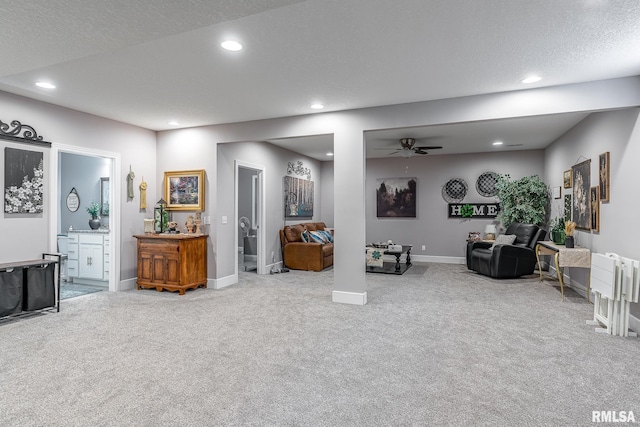 living room featuring recessed lighting, a textured ceiling, carpet, and ceiling fan
