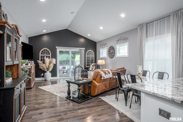 living area with recessed lighting, baseboards, vaulted ceiling, and dark wood-style flooring