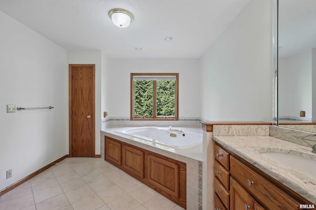 bathroom featuring vanity, a garden tub, and tile patterned flooring