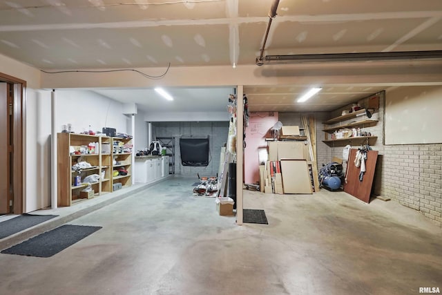 below grade area featuring brick wall