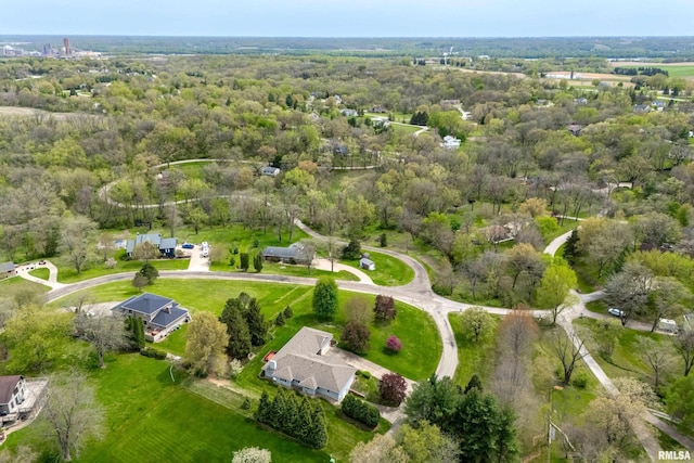 birds eye view of property featuring a wooded view