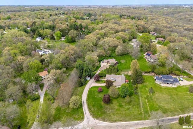 aerial view featuring a wooded view