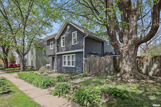 view of front of property featuring fence