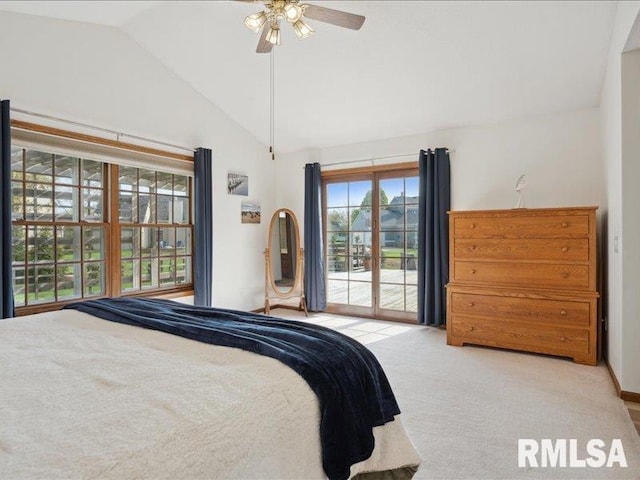 carpeted bedroom featuring access to outside, a ceiling fan, and vaulted ceiling