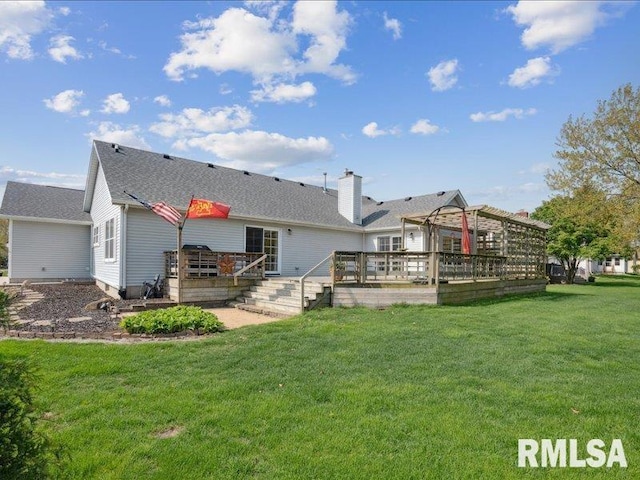 back of house featuring a wooden deck and a yard