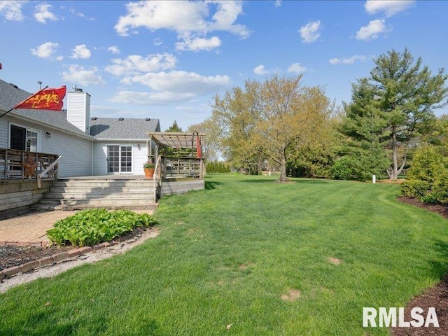 view of yard featuring a wooden deck