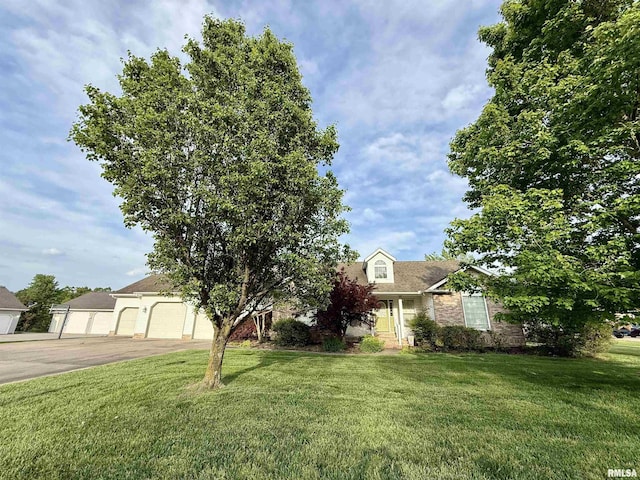 106 Jeremy Dr, Carterville, IL 62918 - view of front of property with brick siding, a garage, and a front yard