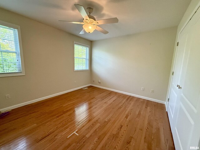 106 Jeremy Dr, Carterville, IL 62918 - empty room with baseboards, visible vents, ceiling fan, and light wood finished floors