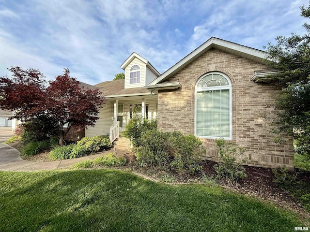 106 Jeremy Dr, Carterville, IL 62918 - view of front of home featuring a front yard and brick siding