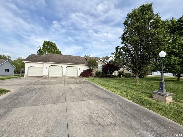 106 Jeremy Dr, Carterville, IL 62918 - exterior space featuring an attached garage, a front yard, and concrete driveway