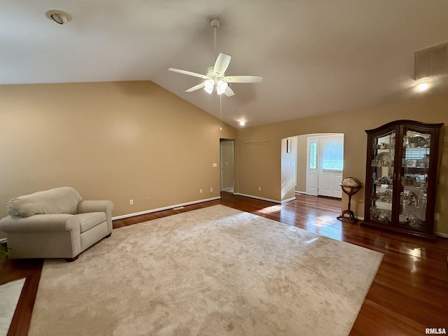 106 Jeremy Dr, Carterville, IL 62918 - unfurnished living room featuring baseboards, ceiling fan, vaulted ceiling, and wood finished floors