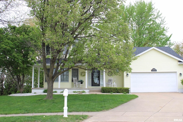 obstructed view of property with an attached garage, driveway, a shingled roof, and a front yard
