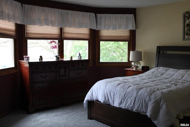 bedroom featuring light carpet