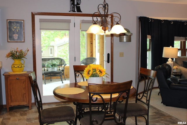 dining area featuring stone finish floor