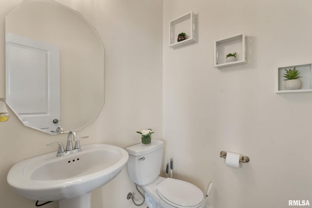 1824 S 5th St, Eldridge, IA 52748 - half bathroom featuring toilet and a sink