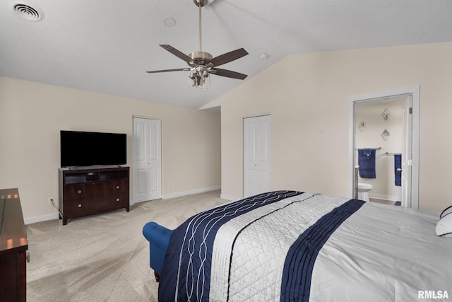 1824 S 5th St, Eldridge, IA 52748 - bedroom with light colored carpet, visible vents, baseboards, lofted ceiling, and ensuite bathroom