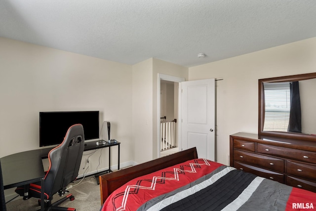 1824 S 5th St, Eldridge, IA 52748 - bedroom featuring carpet flooring, a textured ceiling, and baseboards
