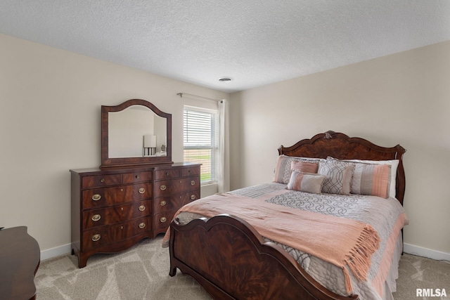 1824 S 5th St, Eldridge, IA 52748 - bedroom with baseboards, a textured ceiling, and light colored carpet