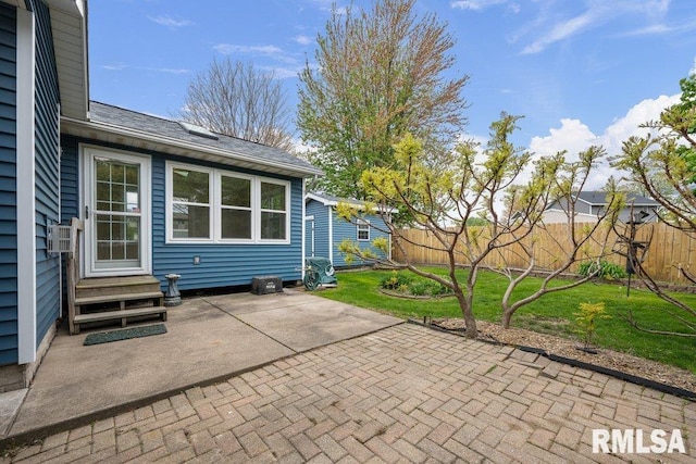 view of patio with fence and entry steps