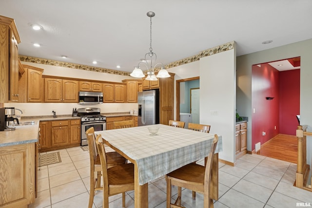 dining space featuring an inviting chandelier, recessed lighting, and light tile patterned floors