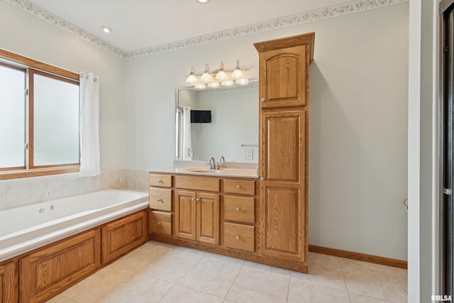 bathroom with a garden tub, tile patterned floors, and vanity