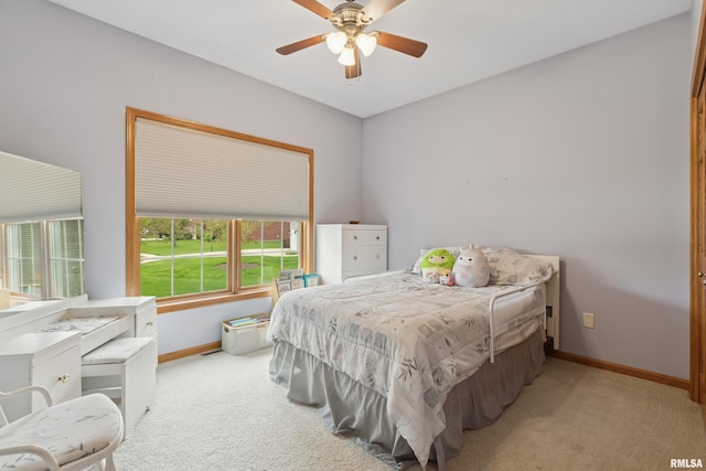 bedroom featuring baseboards, carpet floors, and ceiling fan