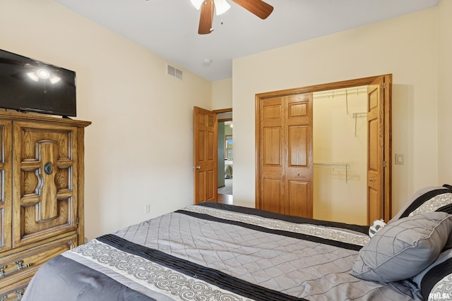 bedroom with a ceiling fan, visible vents, and a closet