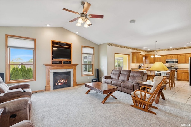 living area featuring a ceiling fan, vaulted ceiling, light carpet, and recessed lighting
