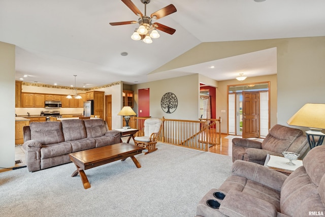 living room with ceiling fan, vaulted ceiling, recessed lighting, and light colored carpet