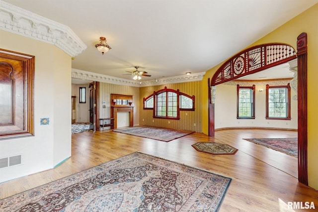 entryway featuring a ceiling fan, visible vents, plenty of natural light, and wood finished floors