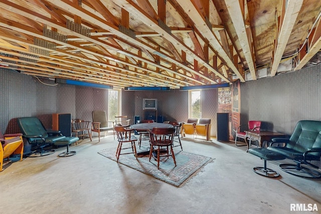 dining space featuring concrete flooring
