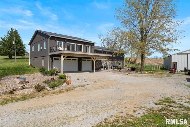 traditional-style home featuring driveway and a garage