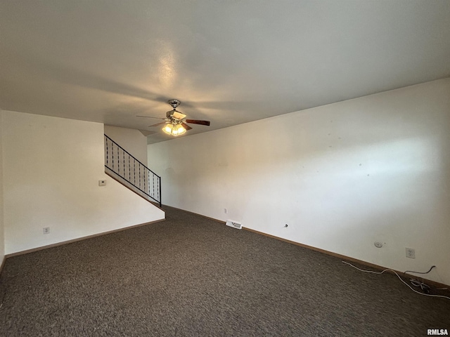 unfurnished living room featuring ceiling fan, visible vents, stairway, carpet floors, and baseboards