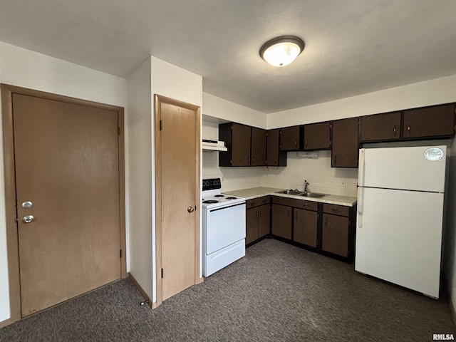 kitchen featuring dark brown cabinetry, a sink, white appliances, light countertops, and under cabinet range hood