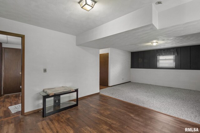 unfurnished room with wood finished floors