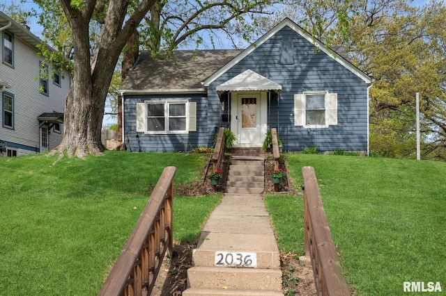 bungalow-style house with a front lawn