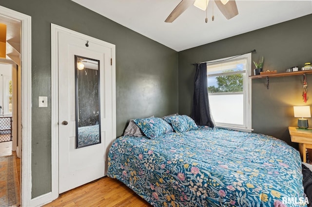 bedroom featuring a ceiling fan and wood finished floors