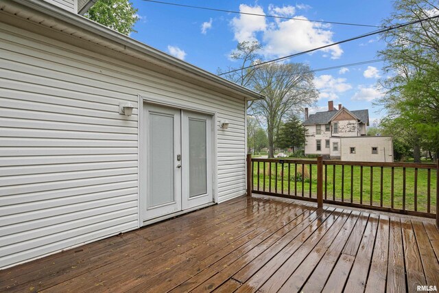 wooden terrace with a lawn