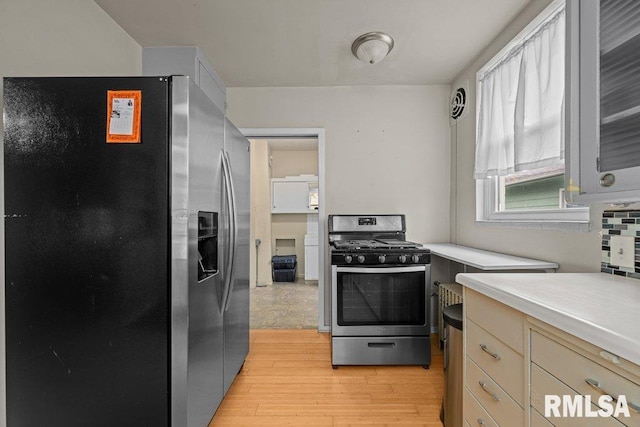 kitchen featuring light countertops, appliances with stainless steel finishes, and light wood-type flooring