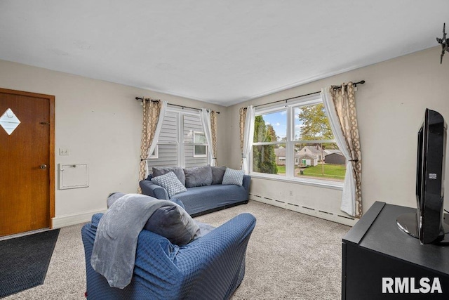 living room with carpet flooring and a baseboard heating unit