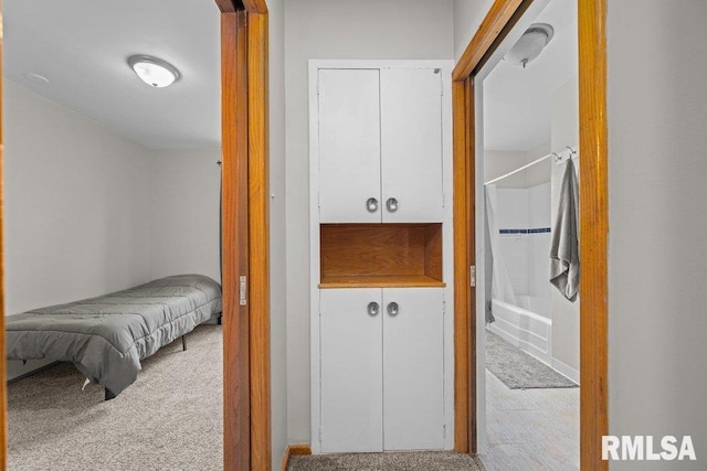 hallway featuring carpet flooring
