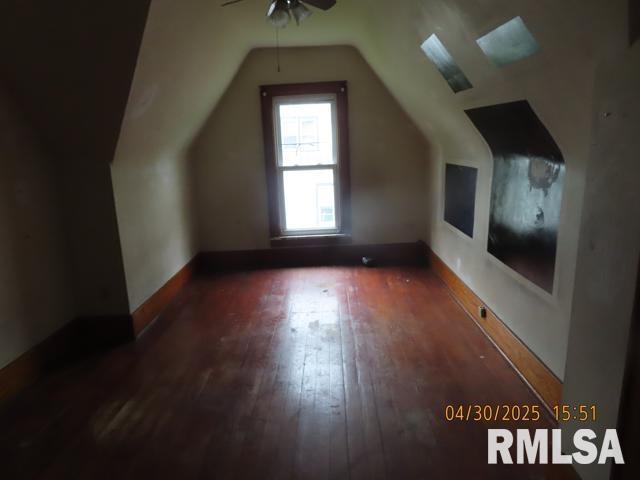 bonus room with a ceiling fan, hardwood / wood-style floors, and lofted ceiling