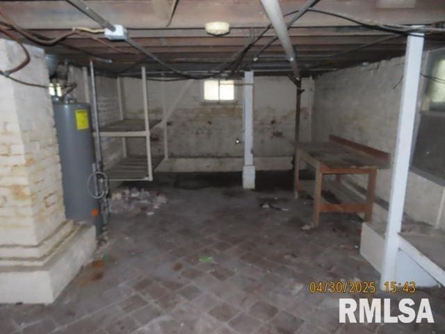 below grade area featuring water heater