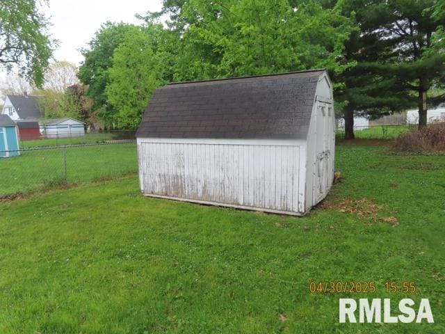 view of shed with fence